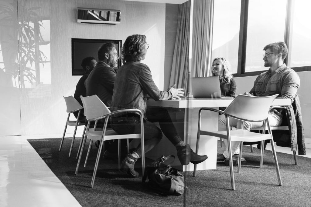 group of professional consultants working in office