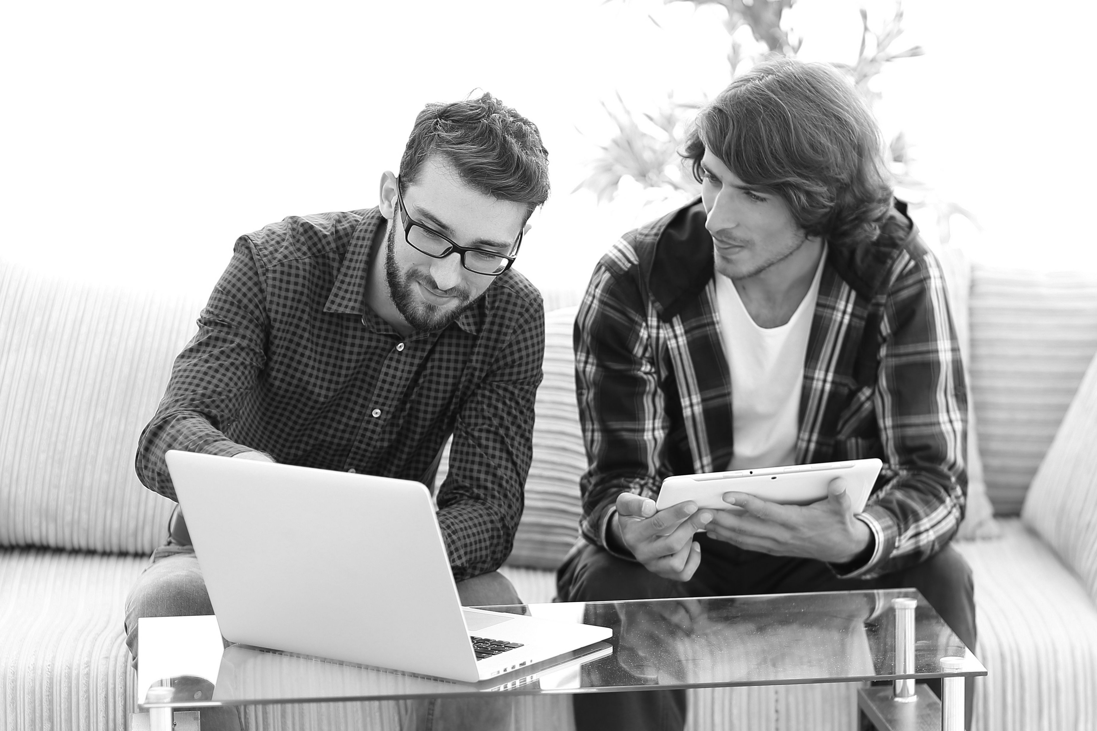 consultants working together on laptop