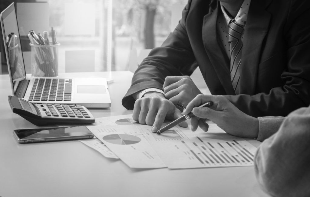 consultants talking and working on charts