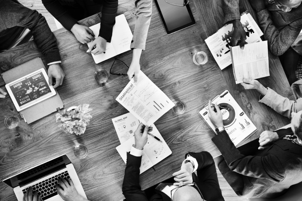 consultants in group working at desk