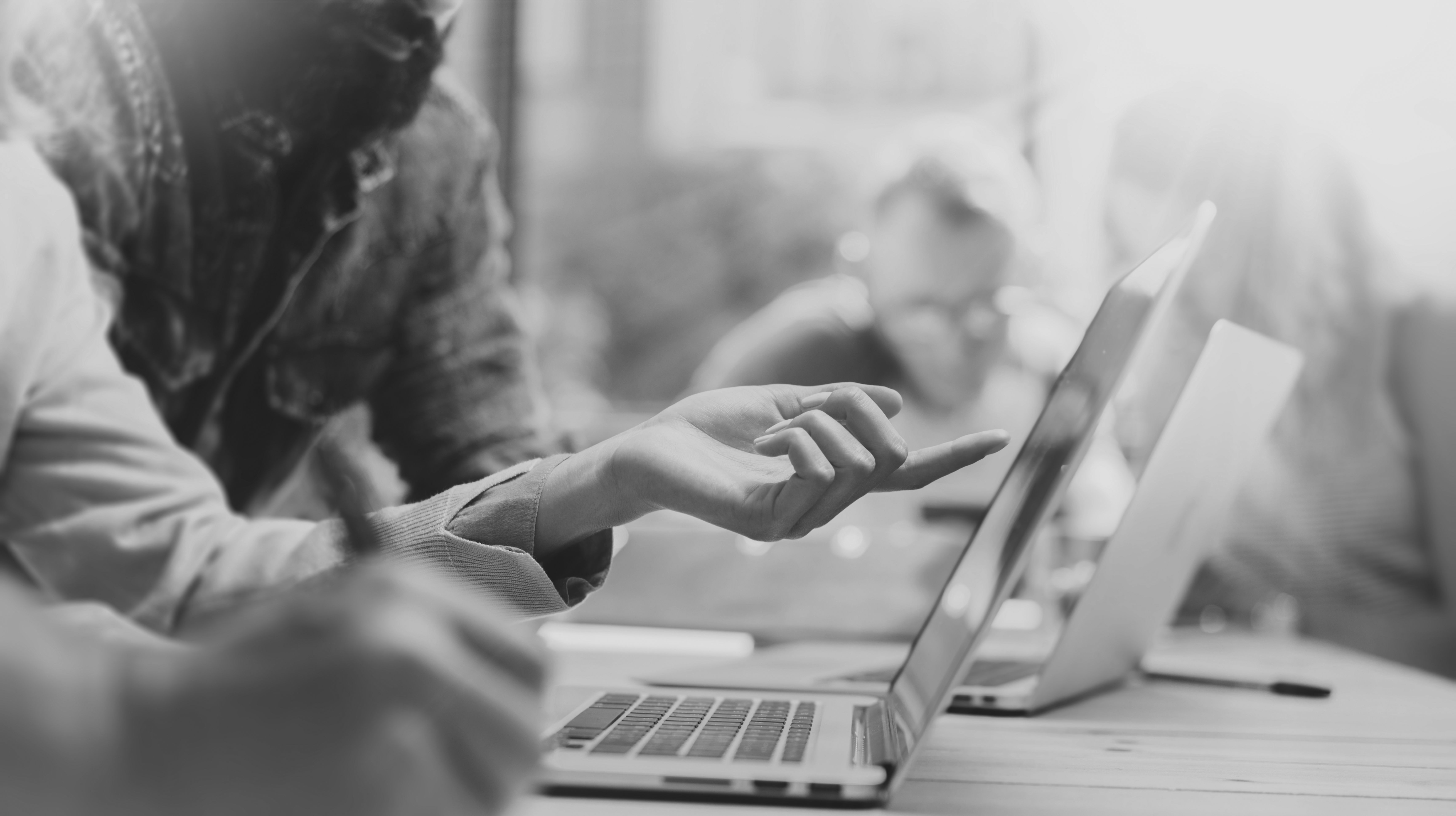 consultants looking at laptop