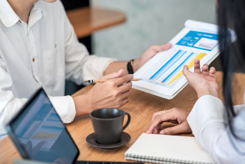 businesspeople looking at charts